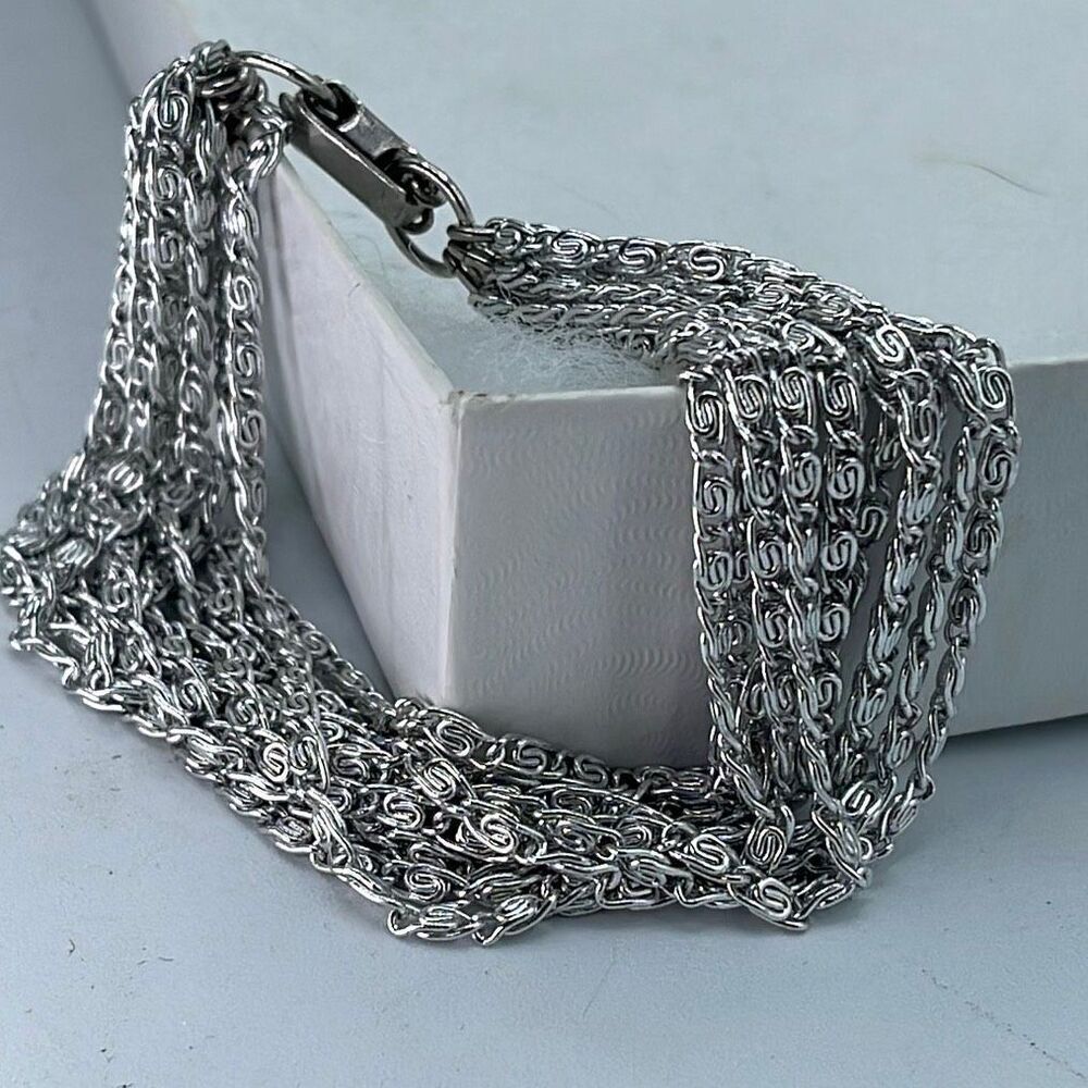 Vintage Celebrity 12 strand paper clip chain silvertone bracelet 7”.